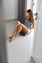 Reading Books. Woman Enjoying Book Home. Recreation, Leisure