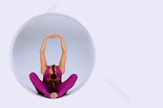 Doing yoga exercises in creative studio