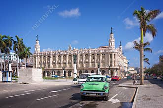 Classic american car on Paseo del Prado, Gran theatro de la Havana in the background