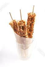 Bread on skewers in glass