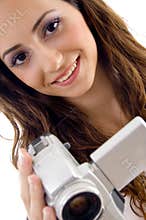 Young female holding handy cam
