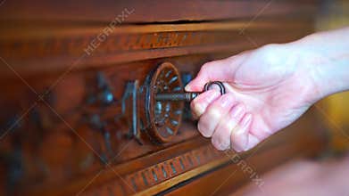 Skeleton key going into old keyhole lock