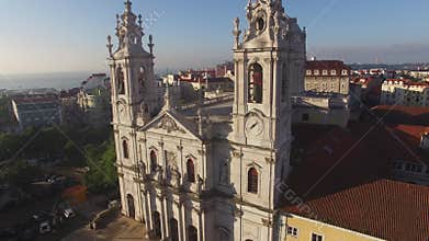 Main facade of the Estrela Basilica in Lisbon at morning aerial view