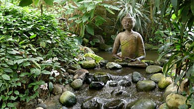 Buddha sculpture, water flowing, duck