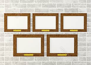 Blank wooden frames on wall