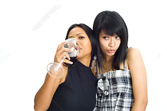 two asian girls with red wine