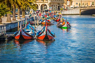 Aveiro, Portugal - 22 May,2015: Moliceiro boats sail along the c