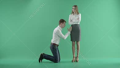 Businessman apologizing businesswoman.Boyfriend trying to convince girlfriend. Man asking for forgiveness.Green screen