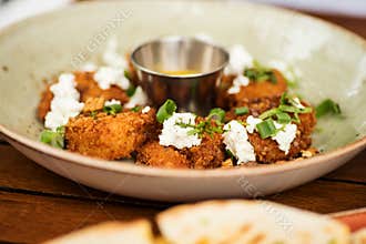 Crispy shrimps with aji amarillo sauce