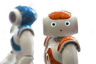 Small robots with human face and body. AI