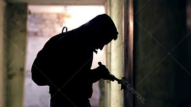 Thief hacking the lock