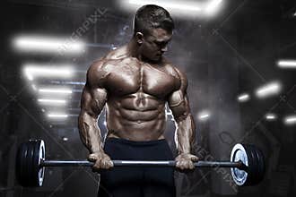 Brutal athletic muscular bodybuilder workout with barbell at gym
