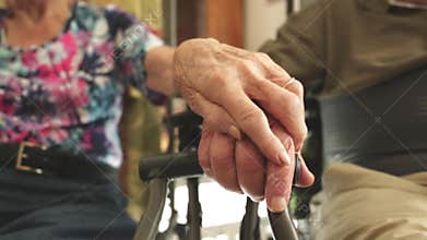 Seniors holding hands