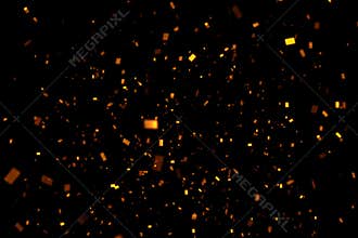 Falling gold sparkle glitter foil confetti, on black background, happy new year holiday and festive fun