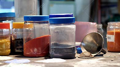 Close-up of frit glass in plastic container