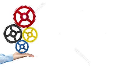 Businessman hand holding gears action background