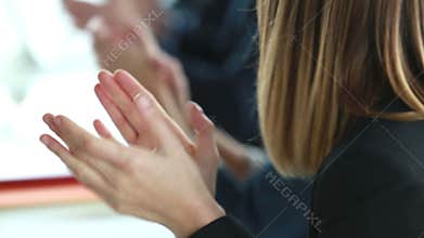 Close up of business people clapping hands