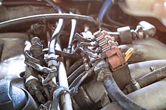 lpg car injectors in old car engine need to service, gas injector installed in gasoline engine to use cheaper alternative fuel.