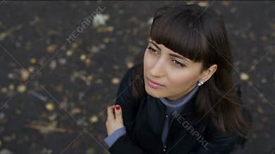 Woman looks with hope to the sky