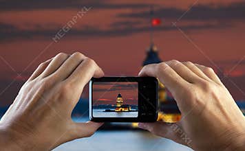Travel concept. Hand making photo of city with camera. Istanbul. Turkey.