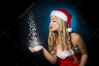Blond girl dressed as Santa Claus