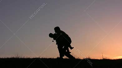 A father hugs his children