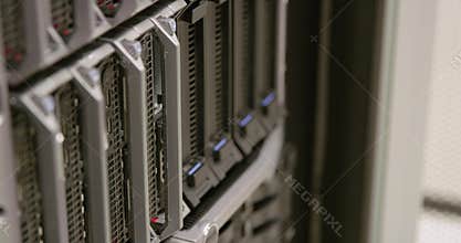 Close-up of IT technician replacing harddrive in server in datacenter