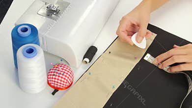 Drawing with chalk on the cloth. Close up