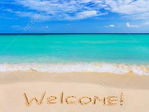 Word Welcome on beach