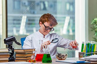 The young crazy chemist working in the lab