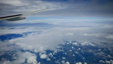 Plane flying over cloud scape