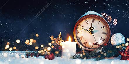 New Year`s clock. Decorated with balls, star and tree on snow