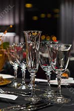 Party table setting, wine and champagne glasses restaurant interior, christmas dinner