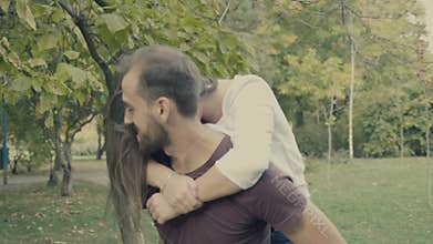 Young girlfriend jumps in her boyfriend arms