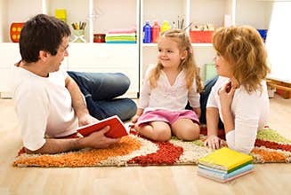 Story time - happy family with a child
