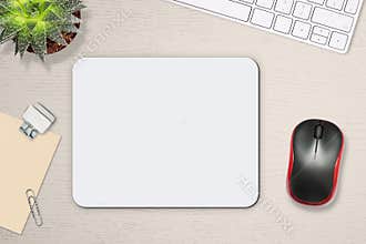 Mouse pad mockup. White mat on the table with props, mouse and keyboard