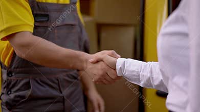 Man and Woman shaking hands. Outdoor.