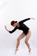 Full body shot of woman ballet dancer posing