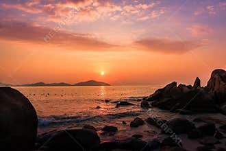 Nature Seascape with Boulders, Islands and Waves at Gorgeous Orange Sunrise