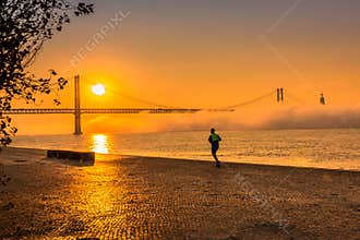 A Man Running at Gorgeous Orange Sunrise