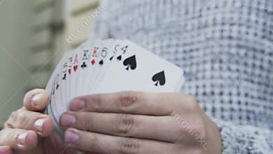 A deck of cards in the hands of an illusionist