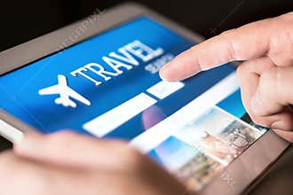 Travel search engine and website for holidays. Man using tablet to look for cheap flights and hotels.