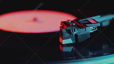 Retro-styled spinning record vinyl player. 4k. Close up. Rotating vintage phonograph close up. Beautiful colorful movie