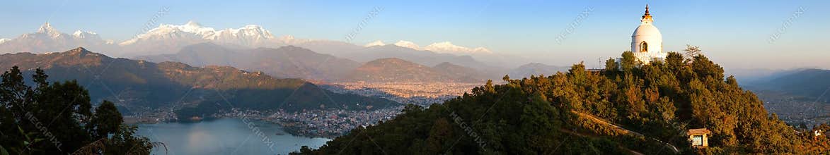 Evening panoramic view of world peace stupa, Phewa lake, Pokhara and great himalayan range, Annapurna, Manaslu, Nepal Himalayas