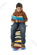 Student sitting on a pile of books