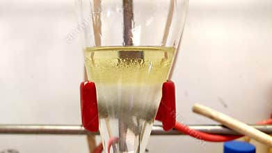 Phase separation of organic layer and water layer in separating funnel