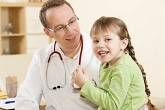 Pediatrician doctor with child patient