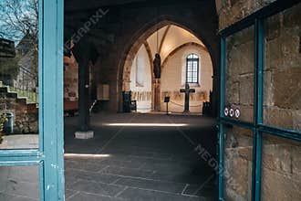 Catholic church interior with medieval walls and arch designed construction