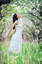 Carefree young woman in white dress