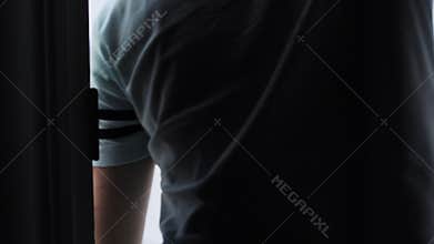 Boy opening the door, Macro shot with focus on the handle